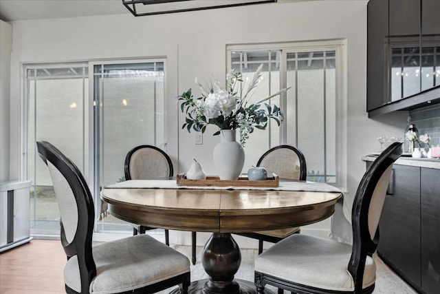 dining area with light wood-type flooring