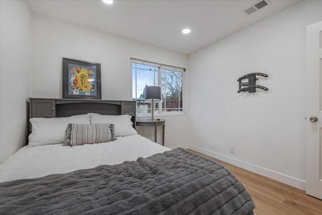 bedroom featuring hardwood / wood-style floors