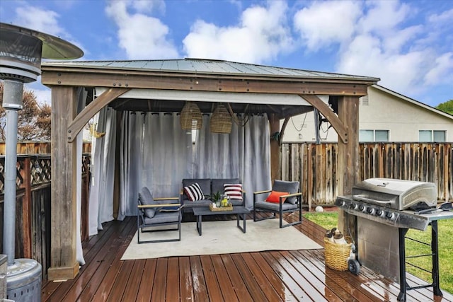 wooden deck featuring a grill, a gazebo, and an outdoor hangout area