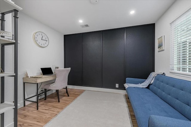 office area with light hardwood / wood-style floors