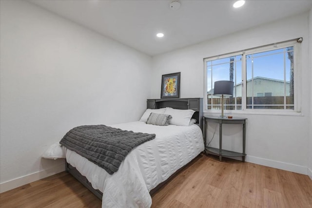 bedroom with light hardwood / wood-style floors