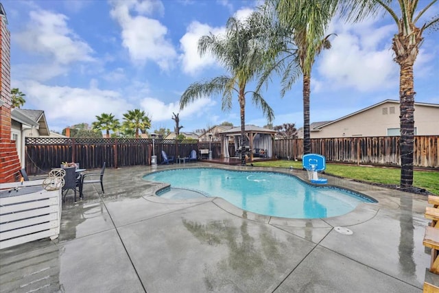 view of swimming pool with a gazebo and a patio area