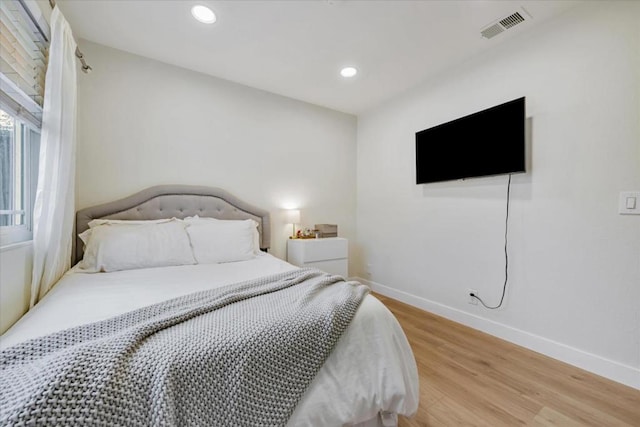 bedroom with light hardwood / wood-style flooring