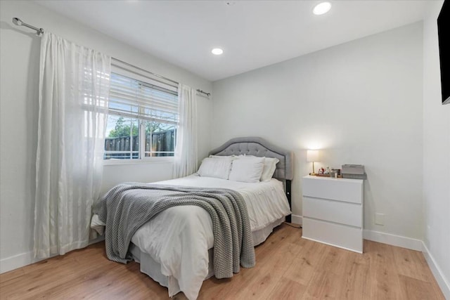 bedroom with light hardwood / wood-style floors