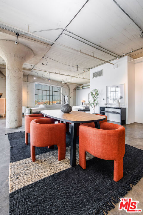 dining area with concrete flooring and a wealth of natural light