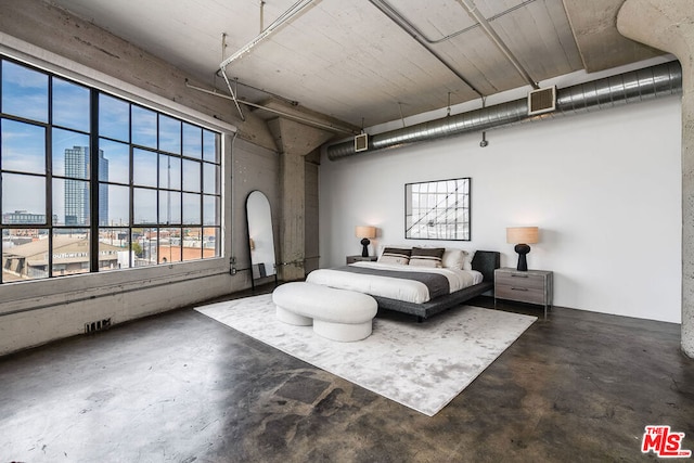 bedroom with concrete floors