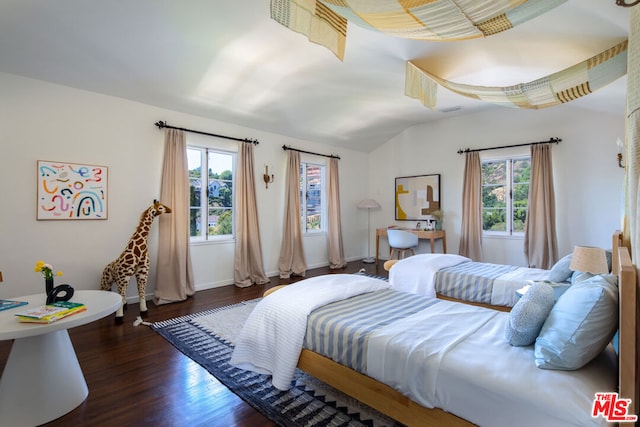 bedroom with dark hardwood / wood-style floors and vaulted ceiling