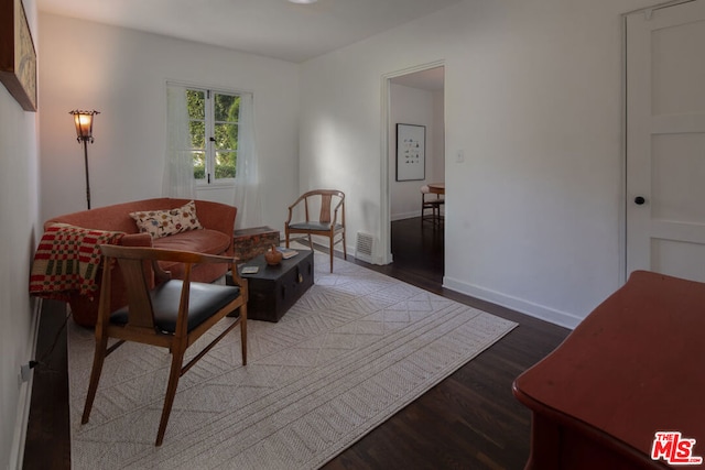 living room featuring dark wood-type flooring