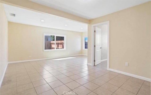 empty room featuring light tile patterned floors