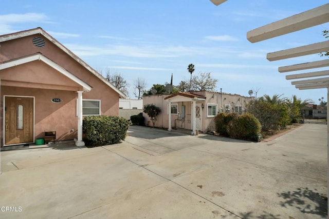 view of side of property with a patio