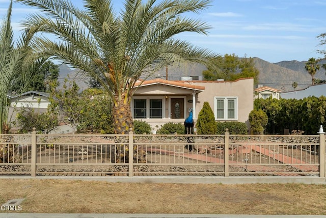 view of front of home featuring a mountain view