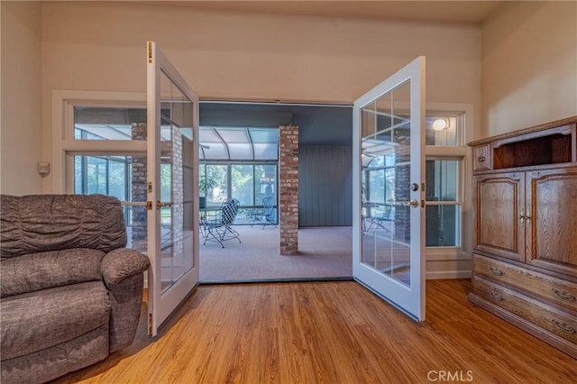 entryway featuring hardwood / wood-style floors and french doors