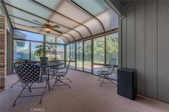 sunroom / solarium featuring ceiling fan