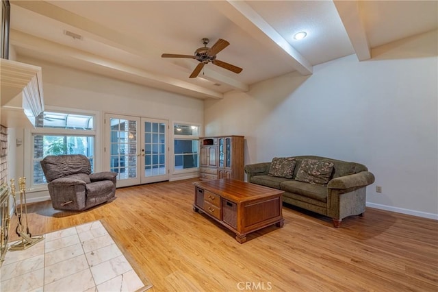 living room with beamed ceiling, ceiling fan, light hardwood / wood-style floors, and french doors