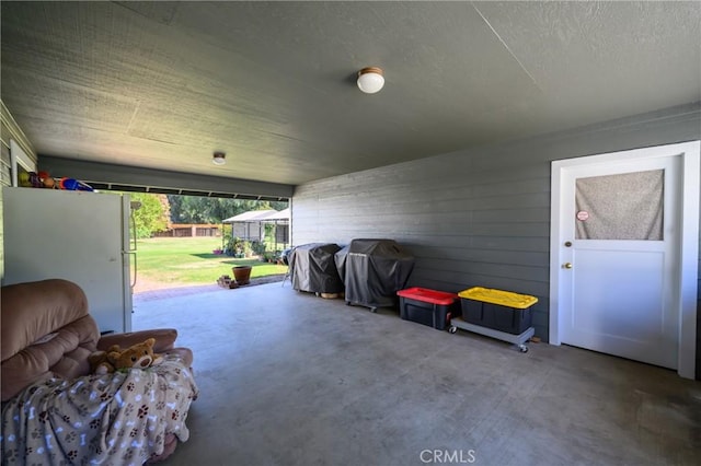 garage with white fridge