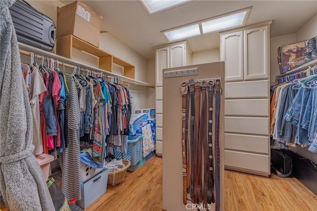 walk in closet featuring light hardwood / wood-style floors