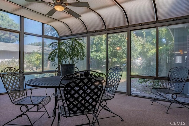sunroom / solarium featuring a wealth of natural light, outdoor dining area, and ceiling fan