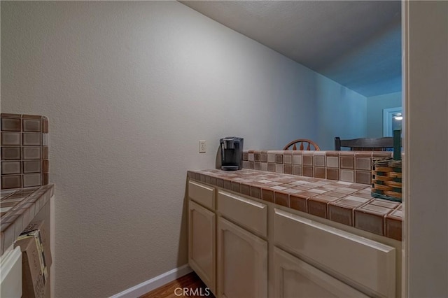 bathroom with hardwood / wood-style flooring