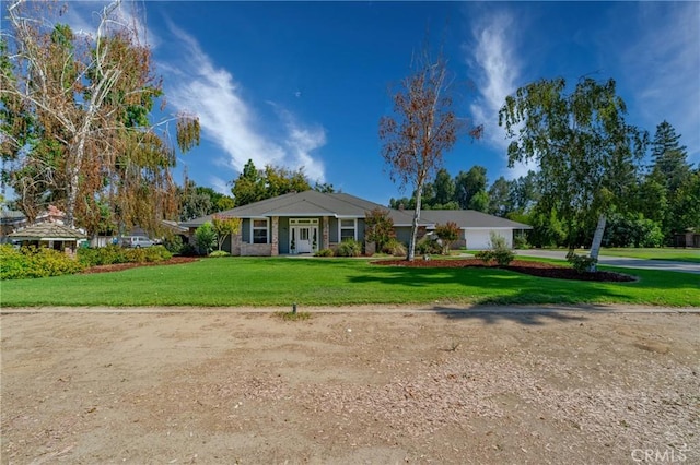 ranch-style house with a front lawn, a garage, and concrete driveway