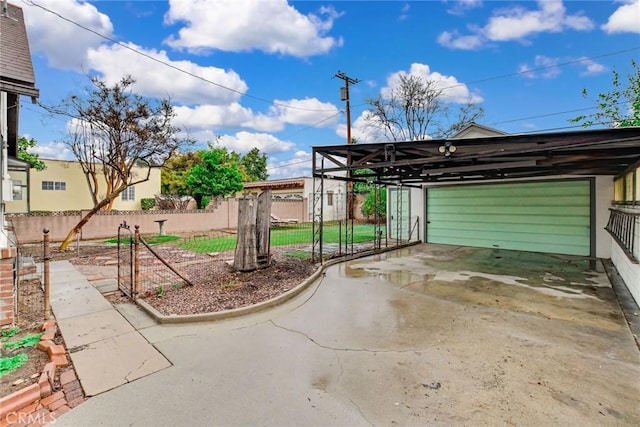 view of patio featuring a garage and a carport