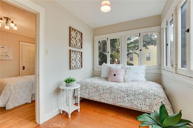 bedroom with hardwood / wood-style floors