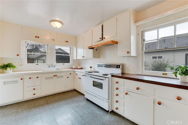 kitchen with white cabinetry, a healthy amount of sunlight, white electric range oven, and sink