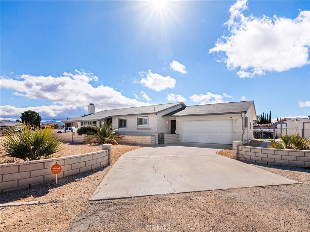 ranch-style home with a garage