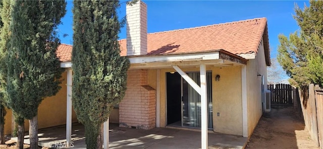 back of property with a patio area