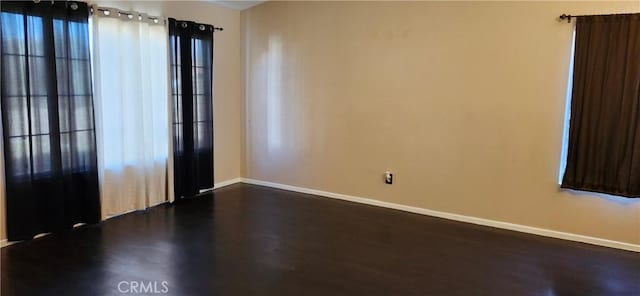 unfurnished room featuring a wealth of natural light