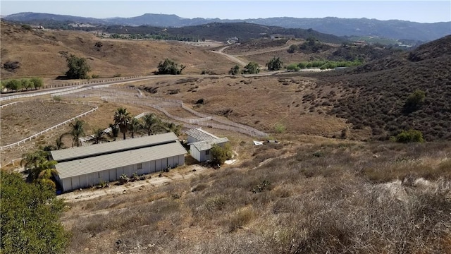 bird's eye view with a mountain view and a rural view