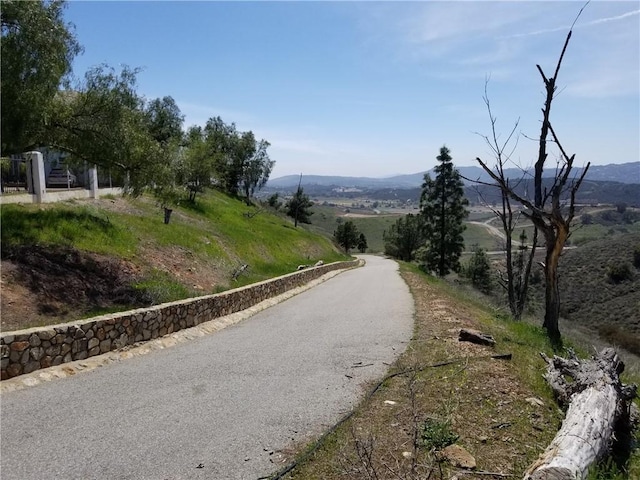 view of road with a mountain view and a rural view