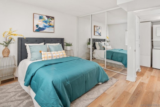 bedroom featuring wood-type flooring and a closet