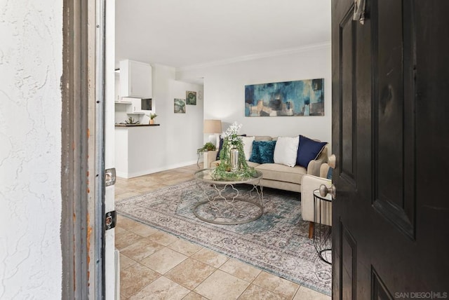 living room with ornamental molding and light tile patterned floors