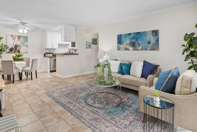 living room with ornamental molding, light tile patterned floors, and ceiling fan