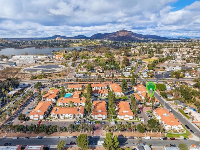 birds eye view of property featuring a water and mountain view