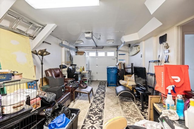 garage featuring a garage door opener and white fridge