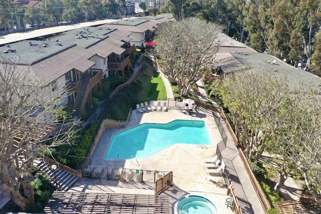 view of swimming pool with a patio and a community hot tub