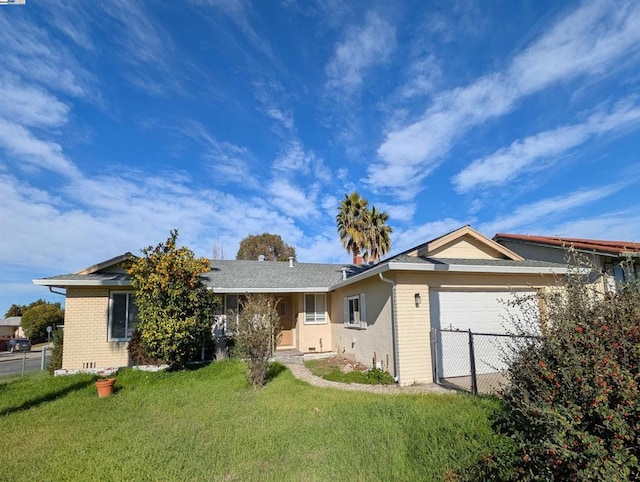 single story home featuring a garage and a front yard