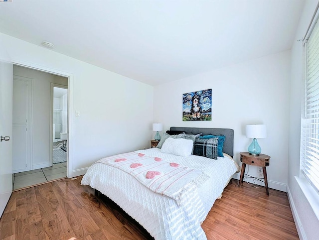 bedroom with hardwood / wood-style floors