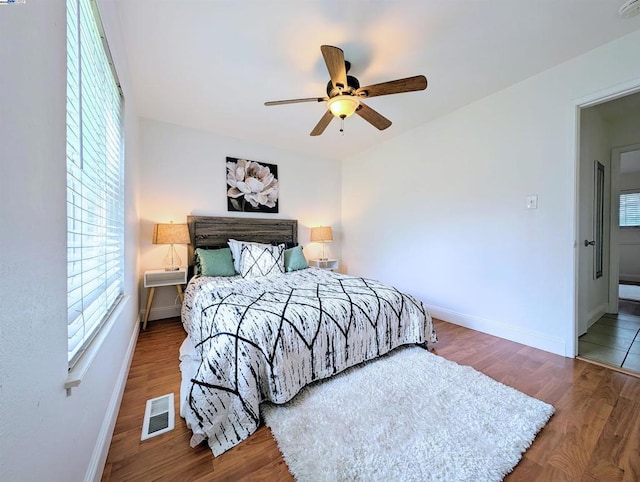 bedroom featuring hardwood / wood-style floors and ceiling fan