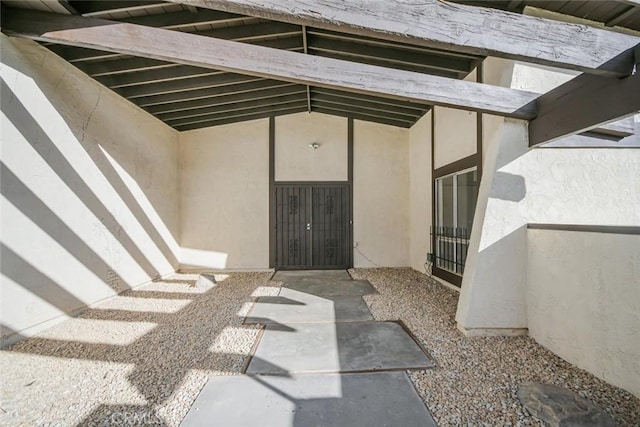 entrance to property with a patio