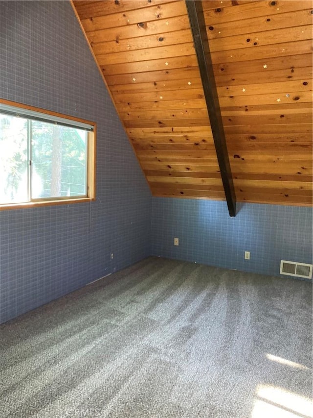 bonus room featuring vaulted ceiling with beams, carpet floors, and wooden ceiling