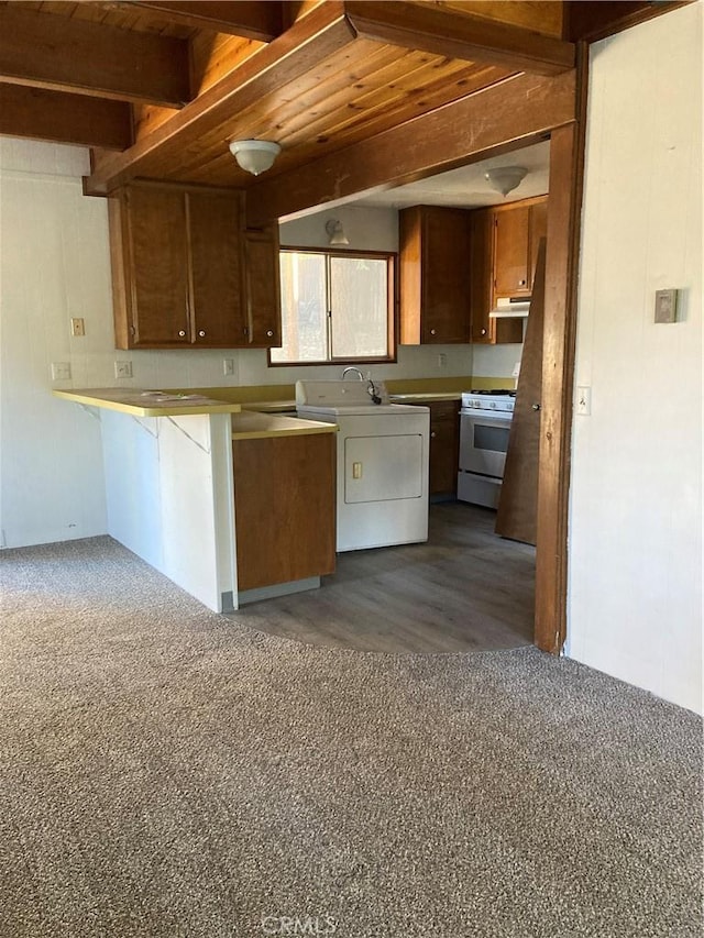 kitchen featuring beamed ceiling, wood ceiling, kitchen peninsula, and white range with gas stovetop