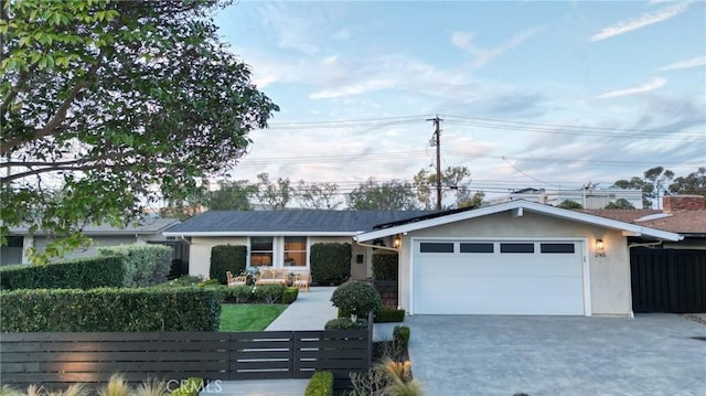 single story home featuring a garage