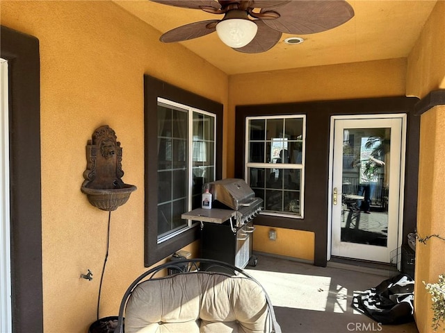 view of patio / terrace featuring area for grilling and ceiling fan