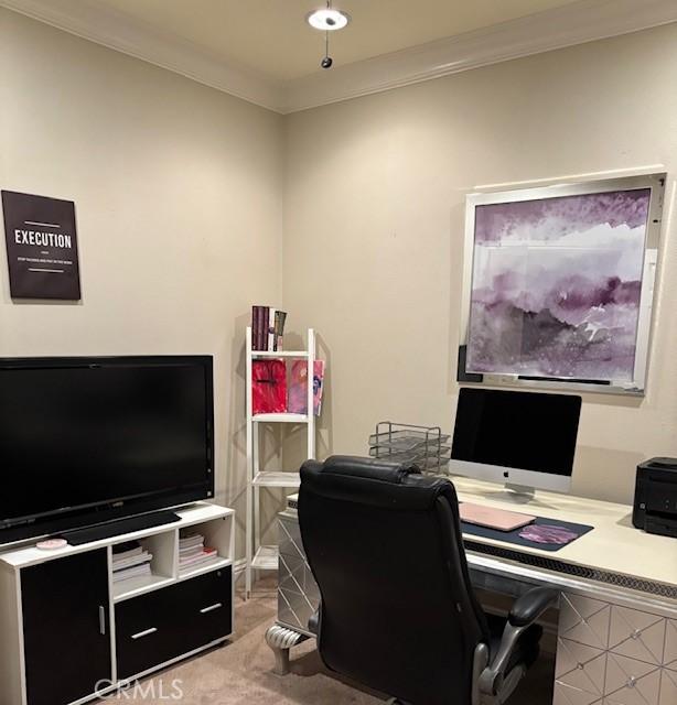 carpeted home office featuring ornamental molding