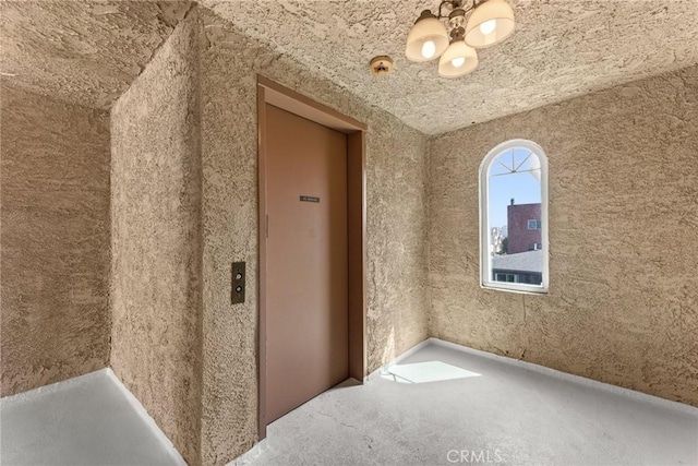 spare room featuring elevator