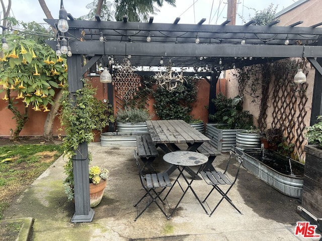 view of patio featuring a pergola