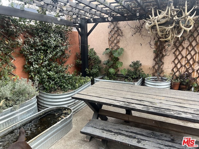 view of patio featuring a pergola