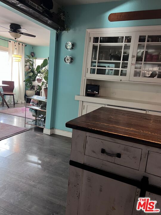 kitchen with white cabinets and ceiling fan